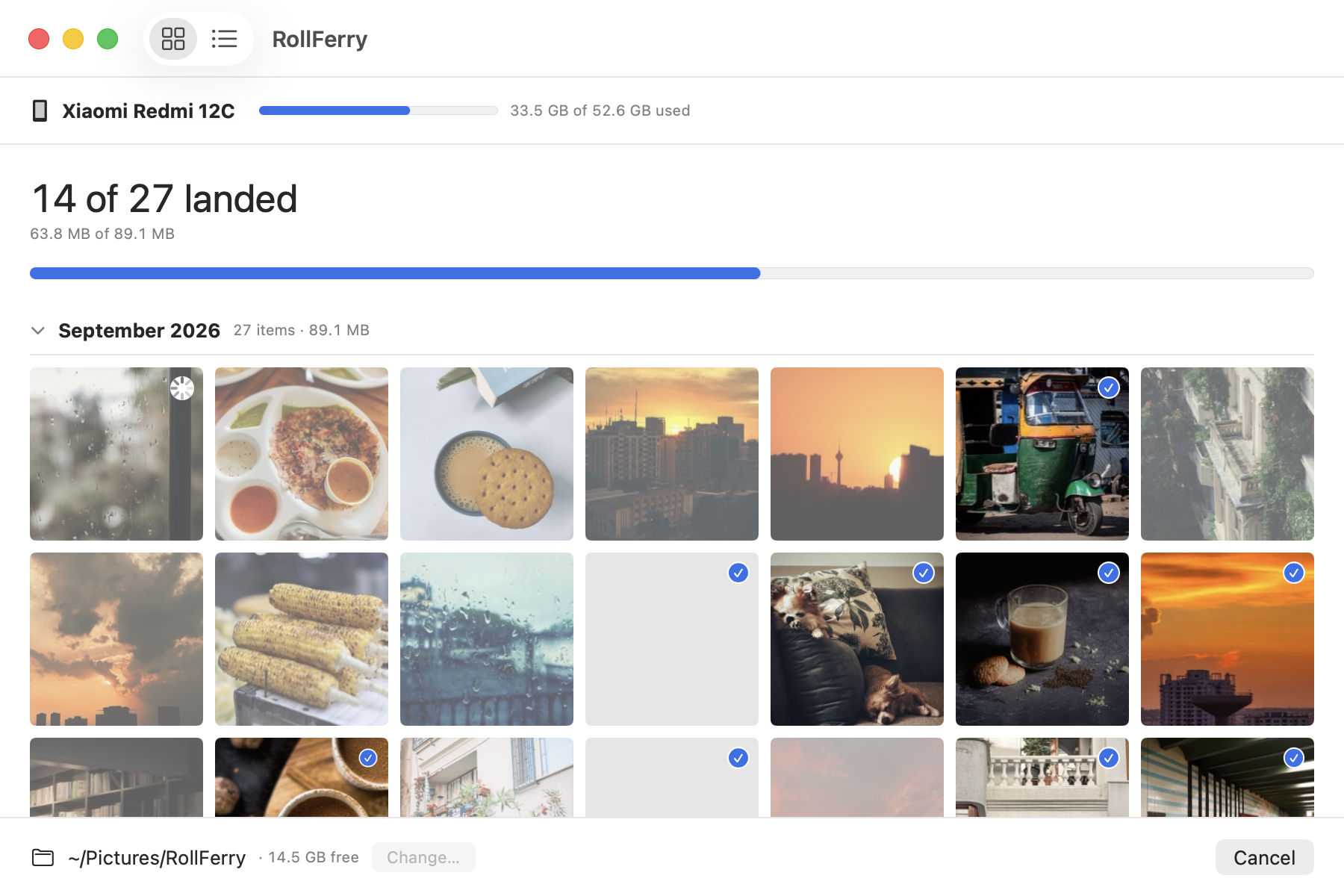 A crossing in progress on the Xiaomi Redmi 12C: “14 of 27 landed” above a progress bar, and a grid of that month’s photos where finished thumbnails carry a blue tick badge and the file in flight shows a spinner. The button at the bottom right reads Cancel.